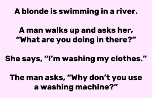 A blonde is swimming in a river.