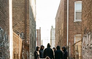 A 10-year-old boy’s daily nightmare of bullying ended the moment a scarred, 100-pound rescue dog dug under a metal fence to protect him, inspiring a legendary neighborhood march that proved he was never truly alone.