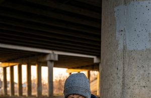 A nine-year-old boy living under a Phoenix overpass begged his mother not to send a starving Pit Bull to a shelter. The eleven words he whispered that freezing October night are the reason all three of them finally have a roof over their heads tonight.